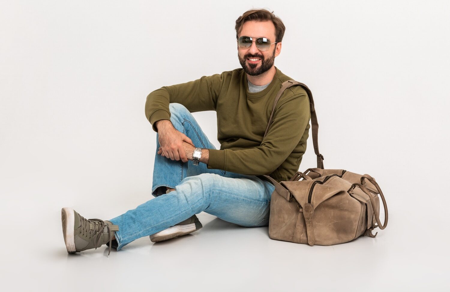 The Ultimate Guide to Building a Versatile Wardrobe for Every Occasion hansome bearded stylish man sitting on floor u8c62kr